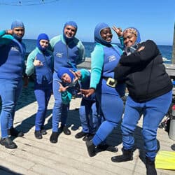 Divers in wetsuits ready for reef education activities at Reef Check.