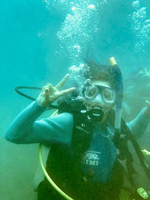 Diver exploring with scuba gear underwater.