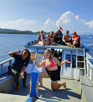 People on a boat conducting reef conservation activities for Reef Check.