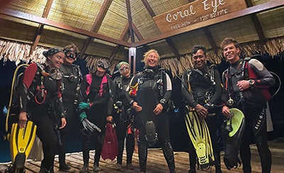 Diver team participating in coral reef conservation efforts with Reef Check.