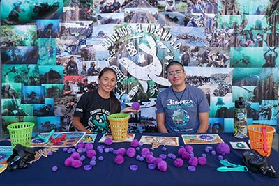 Volunteers at an outreach booth
