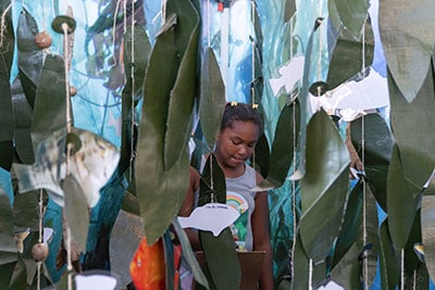 Child inside a model kelp forest display