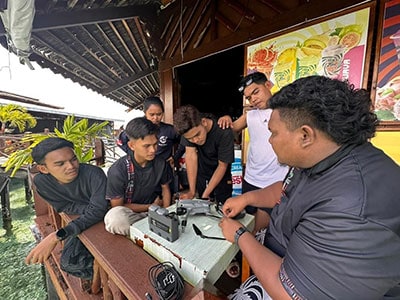 Participants learning how to operate a drone